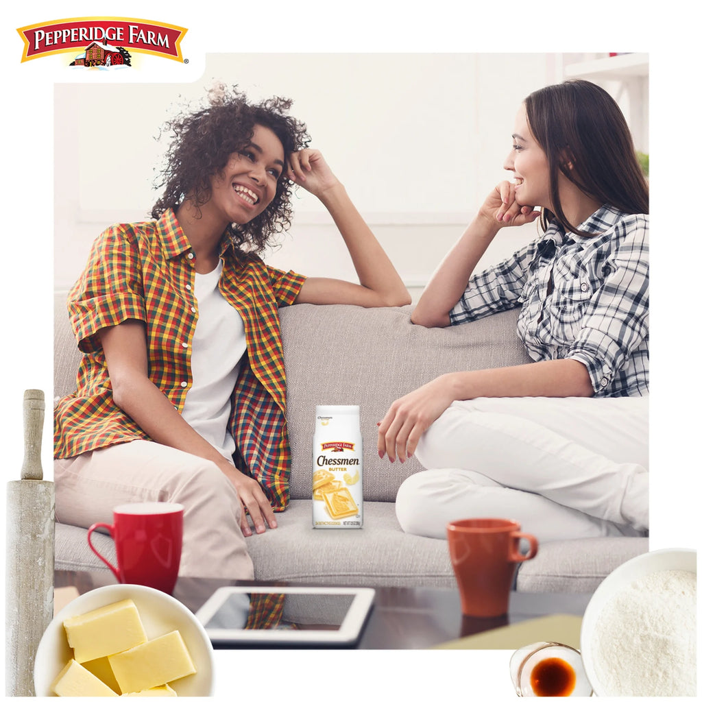Two women sitting on a couch with Pepperidge Farm products.